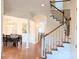 Welcoming foyer with hardwood floors, a staircase, and an elegant dining room at 408 Presidio Dr, Rock Hill, SC 29732