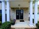 Inviting front entrance with double doors, white pillars, and a decorative potted flower arrangement at 408 Presidio Dr, Rock Hill, SC 29732