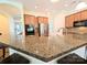 Open kitchen featuring granite countertops, stainless steel appliances, and wood cabinetry at 408 Presidio Dr, Rock Hill, SC 29732