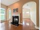 Cozy living room area featuring a charming fireplace and abundant natural light from multiple windows at 408 Presidio Dr, Rock Hill, SC 29732