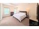 Cozy bedroom with a large bed, two bedside tables, two windows, and a dresser at 408 Presidio Dr, Rock Hill, SC 29732