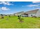 A beautiful backyard with a well-manicured lawn and patio area with a gazebo at 410 Apex Cir, Shelby, NC 28152