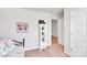 Bedroom with a white shelving unit, floral wall art, carpeted floors and a view into the hallway at 410 Apex Cir, Shelby, NC 28152
