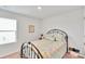 Cozy bedroom featuring a metal bed frame and brightly patterned bedding, creating a cheerful and inviting space at 410 Apex Cir, Shelby, NC 28152