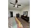 The bedroom features a vaulted ceiling, ceiling fan, and a nice dresser at 410 Apex Cir, Shelby, NC 28152