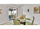 Dining area with table and seating that leads to outdoor patio with grill at 410 Apex Cir, Shelby, NC 28152