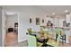 Charming dining area with seating adjacent to an open kitchen and view to a bedroom at 410 Apex Cir, Shelby, NC 28152