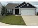 Charming single-Gathering home featuring a two-car garage, well-manicured lawn, and inviting curb appeal at 410 Apex Cir, Shelby, NC 28152