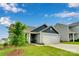 Nice front exterior view featuring landscaped yard and two-car garage at 410 Apex Cir, Shelby, NC 28152