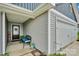 Inviting front porch with seating and a well-maintained entrance at 410 Apex Cir, Shelby, NC 28152