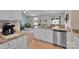 Open kitchen with granite countertops, stainless steel appliances, and bright lighting at 410 Apex Cir, Shelby, NC 28152