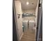 This laundry room includes a washer, dryer, and wire shelving at 410 Apex Cir, Shelby, NC 28152