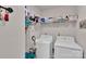 Functional laundry room equipped with modern washer and dryer, plus shelving for storage and organization at 410 Apex Cir, Shelby, NC 28152