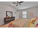Well-lit main bedroom with ceiling fan and view into the bathroom at 410 Apex Cir, Shelby, NC 28152