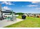 Cozy patio area with a grill, table and chairs under a gazebo at 410 Apex Cir, Shelby, NC 28152