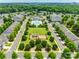 Community aerial view showcasing a pool and playground nestled within lush green spaces, offering a balanced lifestyle at 4107 Park South Station Blvd, Charlotte, NC 28210