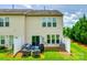 Backyard featuring patio furniture, grill, lawn, and a view of the property's rear exterior at 4107 Park South Station Blvd, Charlotte, NC 28210