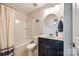Bathroom with a tub, shower, round mirror, and modern vanity at 4107 Park South Station Blvd, Charlotte, NC 28210