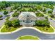Grand clubhouse featuring an outdoor pool and manicured landscaping offering luxurious community amenities at 4107 Park South Station Blvd, Charlotte, NC 28210