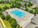 Community pool area surrounded by lounge chairs, inviting residents to relax and soak up the sun in style at 4107 Park South Station Blvd, Charlotte, NC 28210