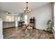 Cozy dining area with wood floors, round table, and view of the living room at 4107 Park South Station Blvd, Charlotte, NC 28210