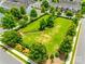 Dog park offering a secure and spacious area for pets to play, surrounded by lush landscaping and seating areas at 4107 Park South Station Blvd, Charlotte, NC 28210