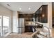 Well-equipped kitchen with stainless steel refrigerator, gas range, and granite countertops at 4107 Park South Station Blvd, Charlotte, NC 28210