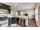 Bright kitchen features granite countertops, stainless steel appliances, and dark wood cabinets at 4107 Park South Station Blvd, Charlotte, NC 28210