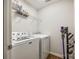 Laundry room with side-by-side washer and dryer and wire shelving at 4107 Park South Station Blvd, Charlotte, NC 28210