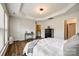 Spacious main bedroom with tray ceilings, wood floors, and multiple windows at 4107 Park South Station Blvd, Charlotte, NC 28210