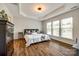 Spacious main bedroom with tray ceilings, wood floors, and large windows at 4107 Park South Station Blvd, Charlotte, NC 28210