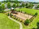 Community playground featuring colorful equipment and well-maintained surroundings, perfect for to have fun at 4107 Park South Station Blvd, Charlotte, NC 28210