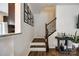 Stairway with wooden steps, iron railings, and decorative wall art at 4107 Park South Station Blvd, Charlotte, NC 28210