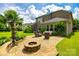 Brick home with large backyard featuring a brick patio and fire pit, perfect for outdoor entertaining at 4220 Thames Cir, Fort Mill, SC 29715