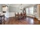 Elegant dining room with hardwood floors, ample natural light, and a traditional chandelier at 4220 Thames Cir, Fort Mill, SC 29715