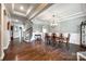 Spacious dining room featuring hardwood floors, tray ceilings, and wainscoting at 4220 Thames Cir, Fort Mill, SC 29715