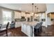 Spacious kitchen with white cabinets, stainless appliances, large island, and hardwood flooring at 4220 Thames Cir, Fort Mill, SC 29715