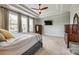 Comfortable main bedroom with neutral decor, ceiling fan, and ample natural light for a relaxing atmosphere at 4220 Thames Cir, Fort Mill, SC 29715