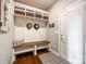 A well-organized mudroom with bench, storage hooks, and basket shelves, offering functionality and style at 4220 Thames Cir, Fort Mill, SC 29715