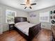 Spacious bedroom offers natural light, wood floors, and a comfortable queen-sized bed at 427 E 12Th Ave, Gastonia, NC 28054