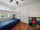 This bedroom offers a cool bunk bed with a cozy blue lower bunk at 427 E 12Th Ave, Gastonia, NC 28054