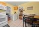 Sunny eat-in kitchen with tile floors, and access to the living room at 427 E 12Th Ave, Gastonia, NC 28054