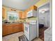 Bright eat-in kitchen with updated appliances and sunny, yellow walls at 427 E 12Th Ave, Gastonia, NC 28054