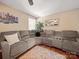 Bright living room with modern furniture, hardwood floors, and a comfortable sectional sofa at 427 E 12Th Ave, Gastonia, NC 28054