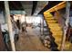 Unfinished basement with block walls, exposed ceiling, and staircase to main floor at 506 Linwood Rd, Gastonia, NC 28052