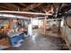 Spacious unfinished basement with exposed ceiling, water heater, and painted walls at 506 Linwood Rd, Gastonia, NC 28052