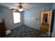 Cozy blue bedroom featuring a window, neutral trim, and standard closet at 506 Linwood Rd, Gastonia, NC 28052