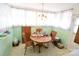 Bright breakfast nook with ample natural light, wood table and chairs, in a cozy home at 506 Linwood Rd, Gastonia, NC 28052
