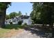 Charming single-story home with mature trees and a spacious front yard at 506 Linwood Rd, Gastonia, NC 28052