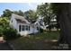 Lovely one-story home with a welcoming front porch and mature trees at 506 Linwood Rd, Gastonia, NC 28052